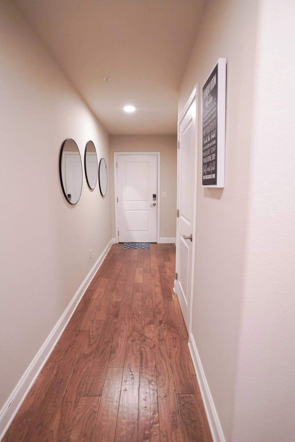 There is a closet next to the front door with all of the beach essentials! The washer and dryer and behind this door by the sign. 