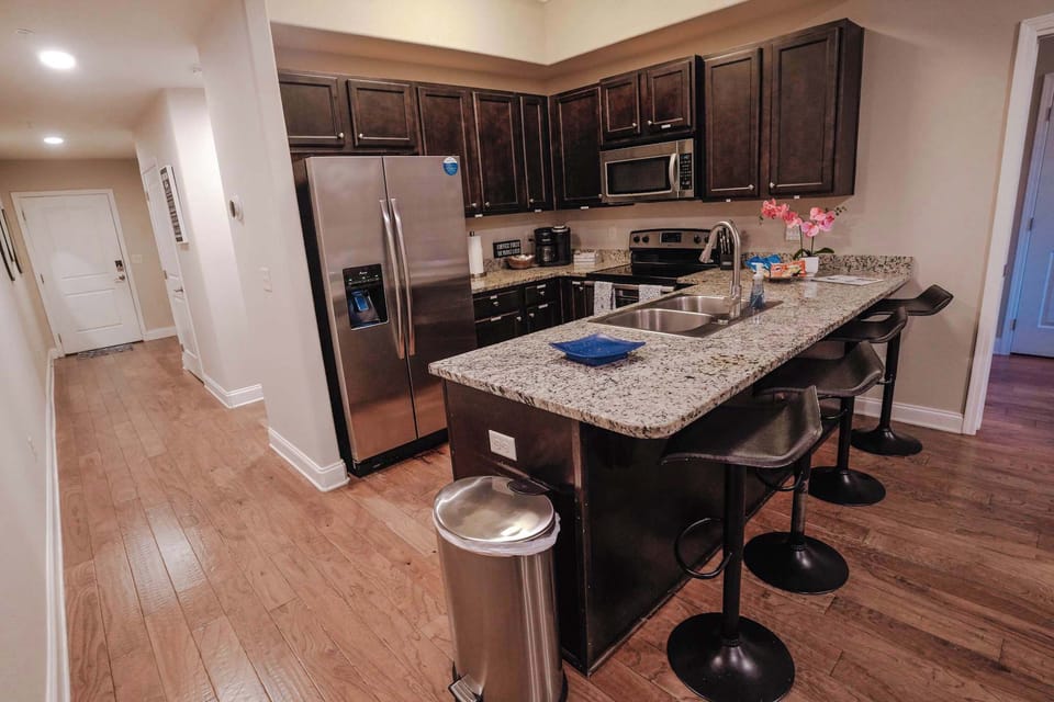 Walk back from your front door, and you'll find this full sized kitchen with seating and all the appliance you could need!