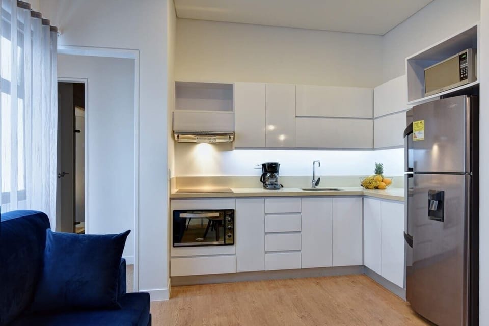 Kitchen with big fridge.