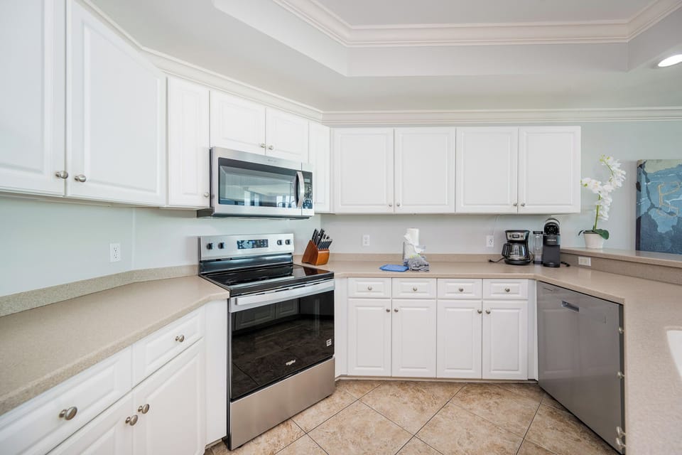 Prepare fresh meals in this bright kitchen with stainless steel appliances