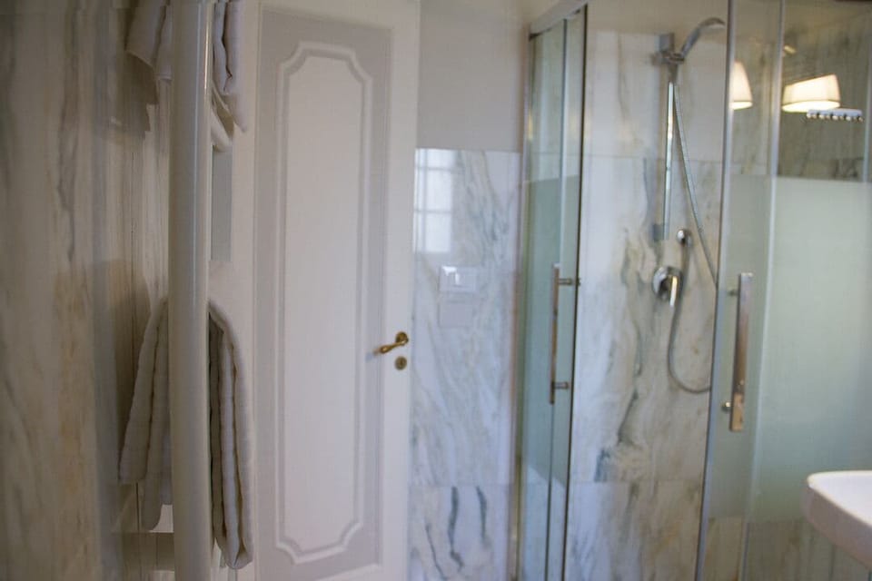 Triple Room | Bathroom | Shower, hair dryer, bidet, towels