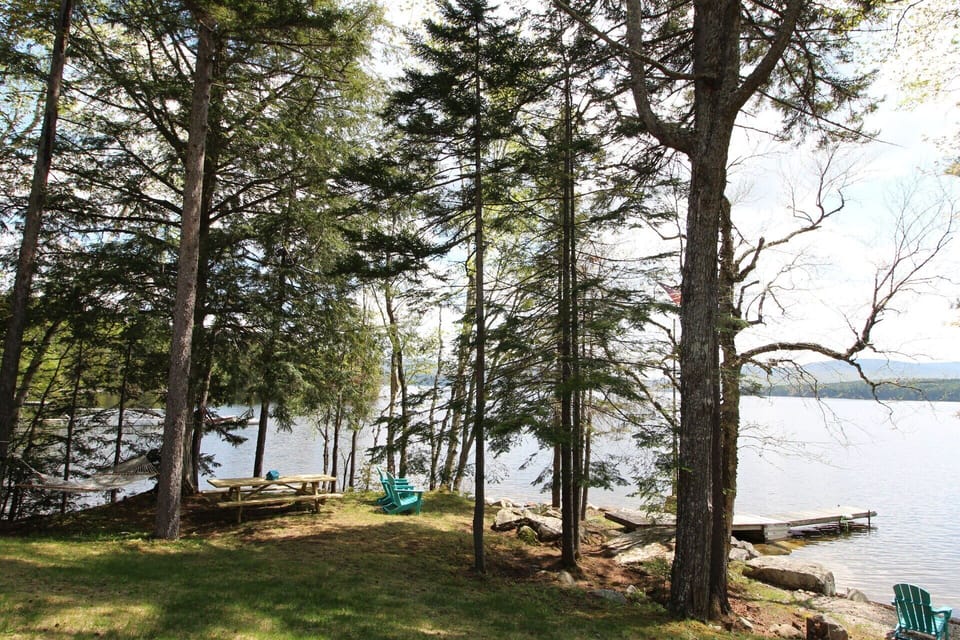 Private yard and pebble beach in a quiet cove.