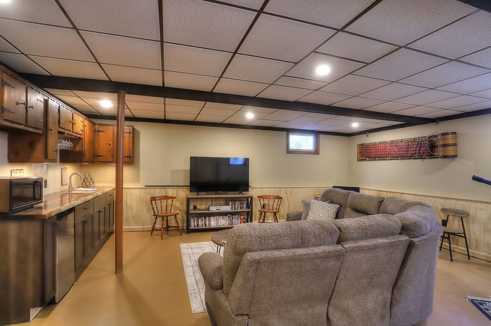 Lower level family room with kitchenette, big screen TV & soundbar, VHS/DVDs