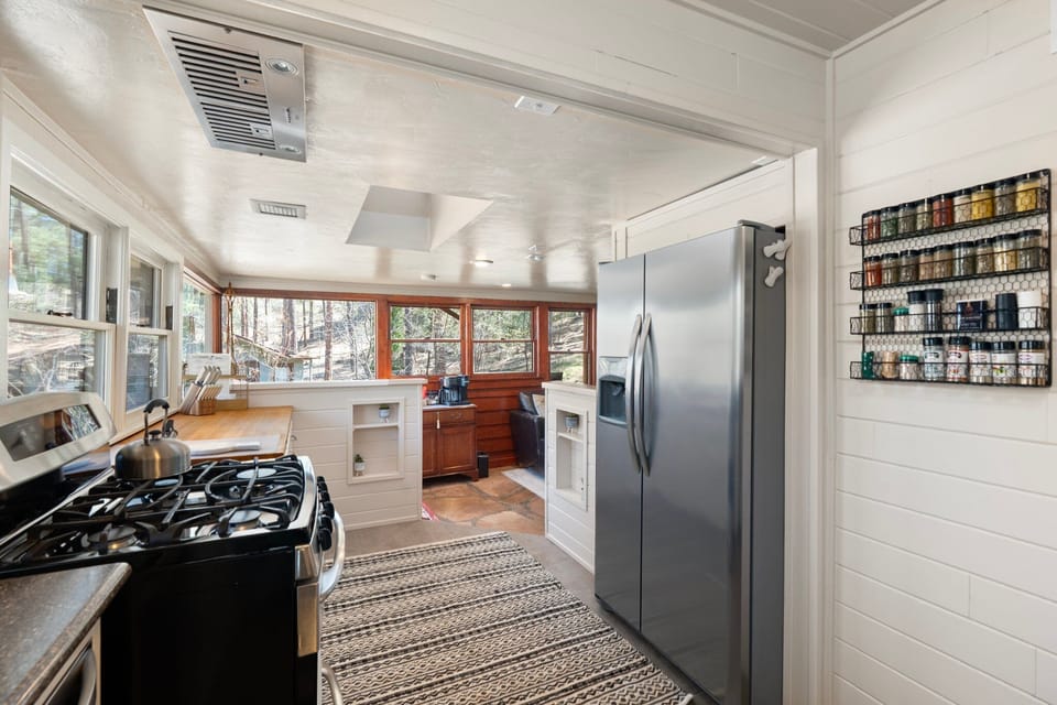 Windows wrapped around the kitchen and into the sitting room. 