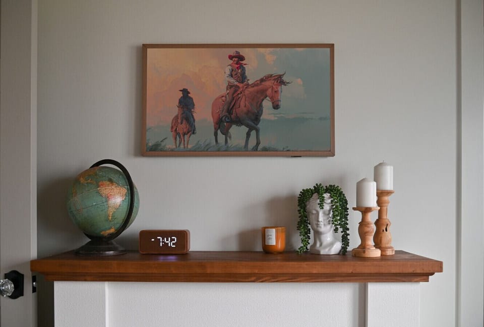 Main bedroom frame TV, bluetooth alarm clock with wireless charging.