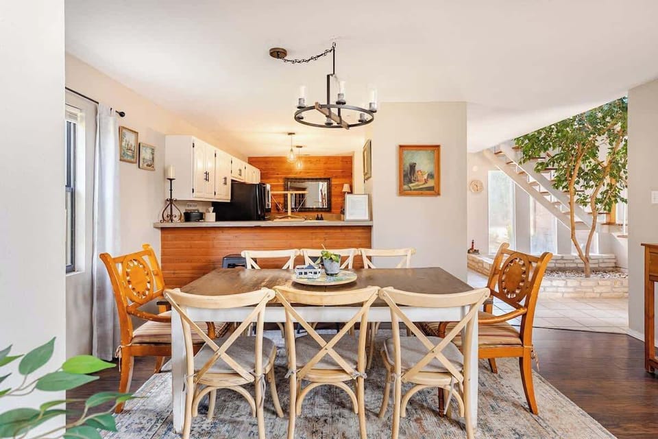 Gather around the spacious dining table, which comfortably seats eight and is perfect for meals, game nights, or coffee. Extra chairs are nearby, so everyone can pull up a seat and feel at home. It’s the perfect setup for together time.