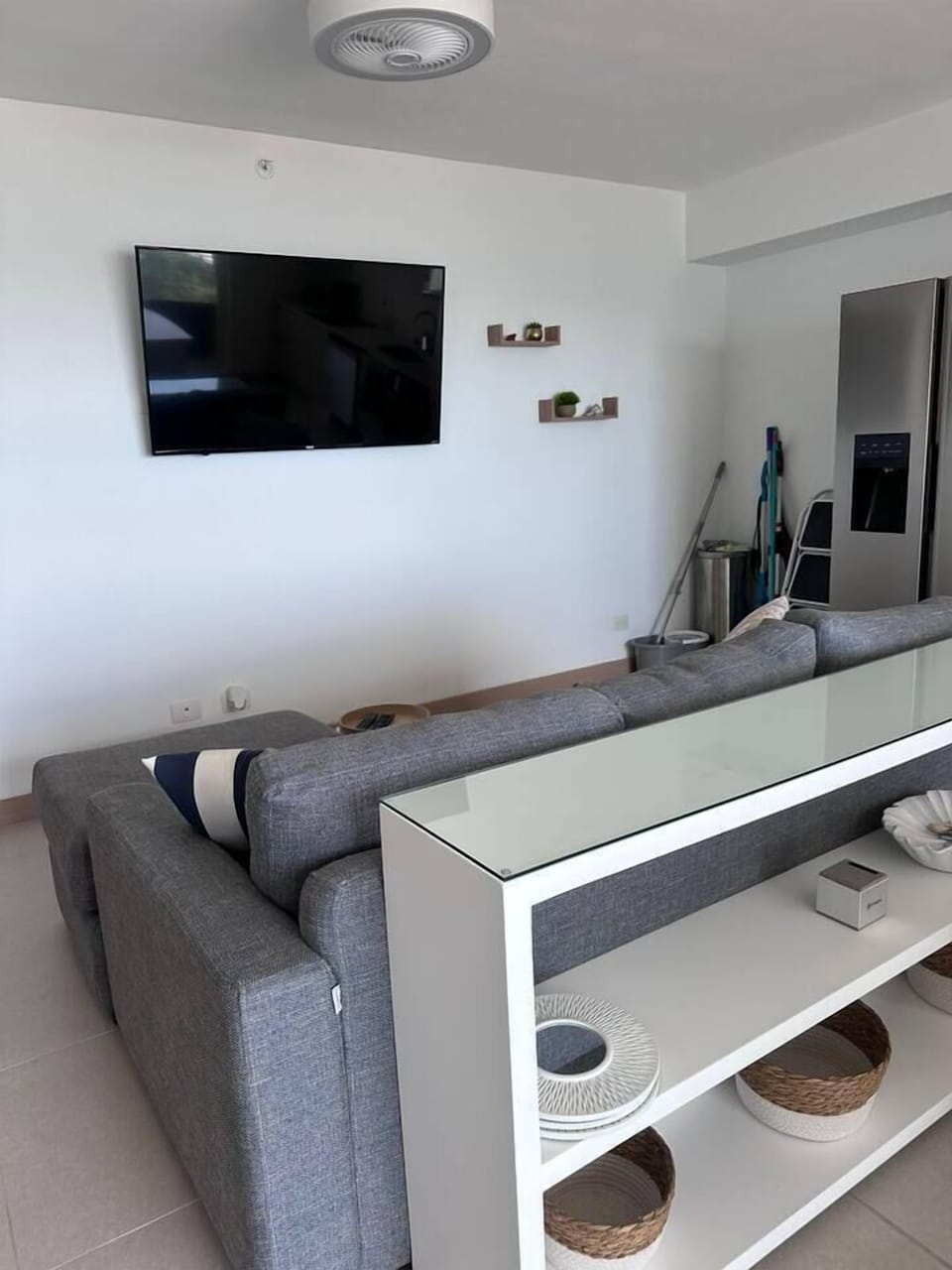 Rear view of couch with living room TV.