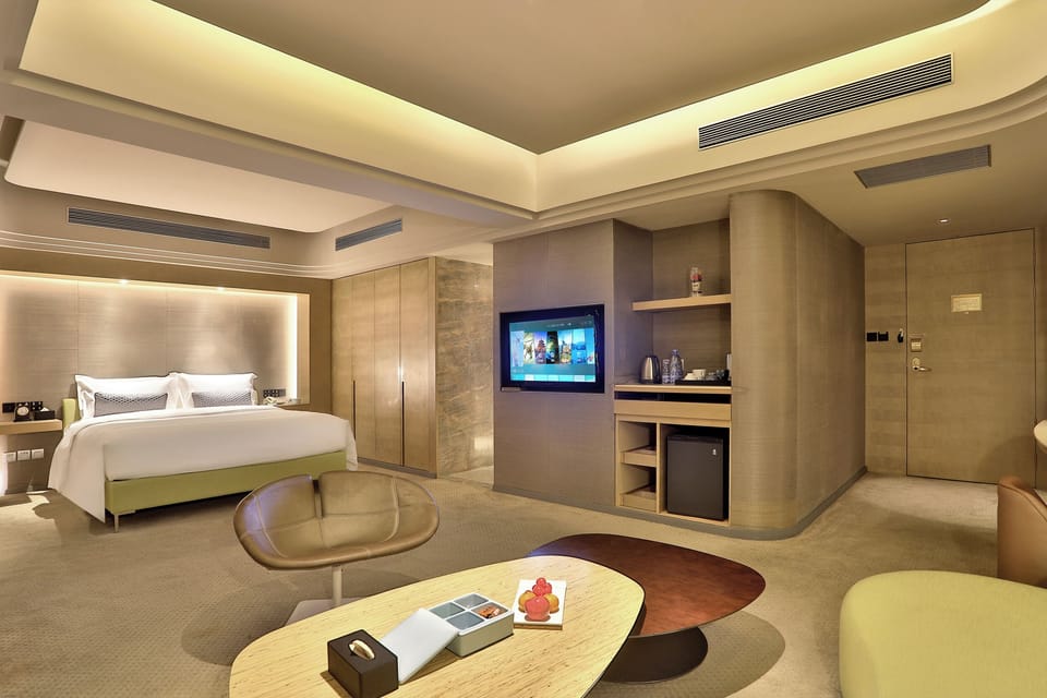 Panoramic Suite, City View | Down comforters, minibar, desk, laptop workspace