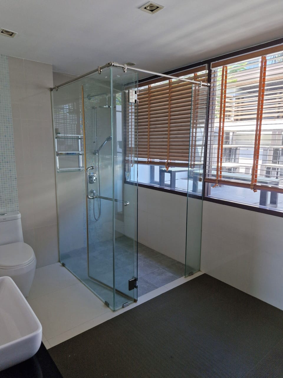 Shower, rainfall showerhead, hair dryer, towels