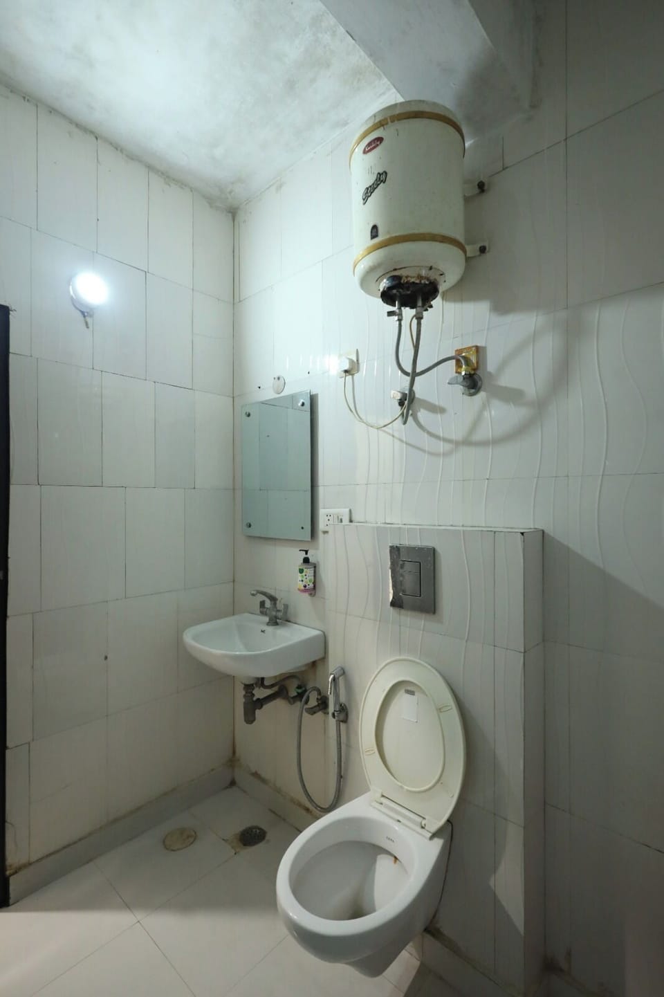 Shower, designer toiletries, slippers, towels