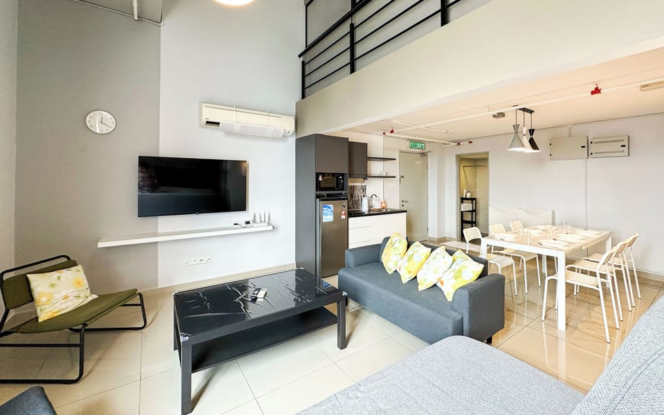 Deluxe Duplex, City View | Living area | 45-inch Smart TV with digital channels