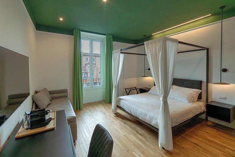 Deluxe Room, Private Bathroom, City View | In-room safe, desk, blackout drapes, iron/ironing board