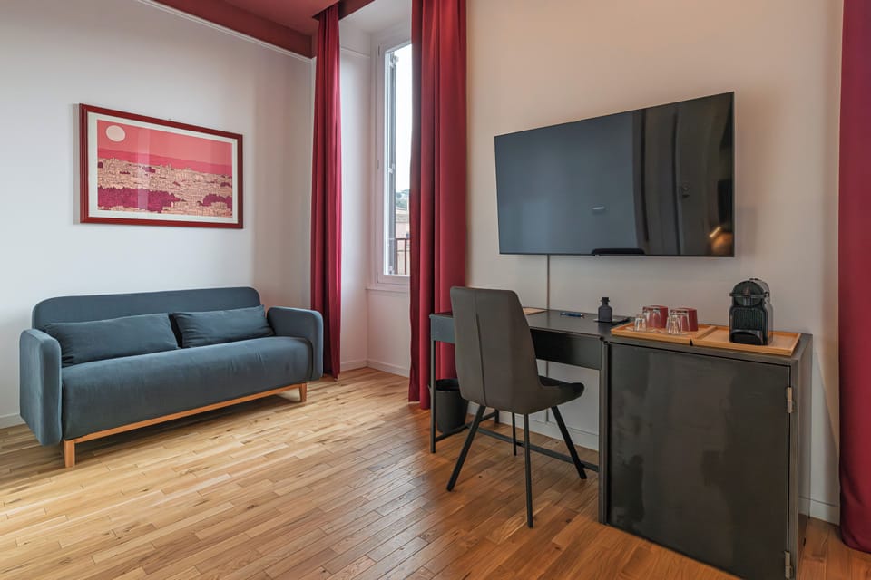 Deluxe Room, Private Bathroom, City View | In-room safe, desk, blackout drapes, iron/ironing board