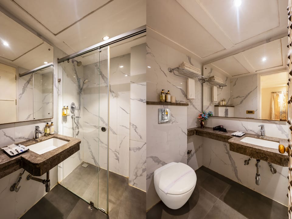 Deluxe Suite, City View | Bathroom | Shower, rainfall showerhead, free toiletries, hair dryer