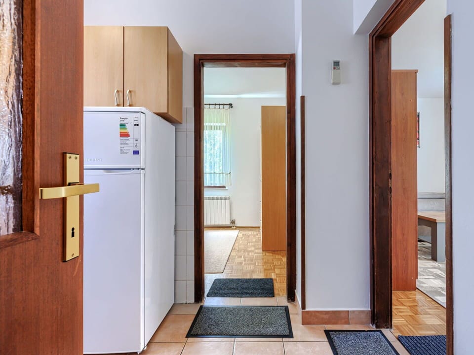 Flooring, Interior Design, Floor, Apartment, Balcony, Ceiling, Condominium, Chair, Shade, Porch