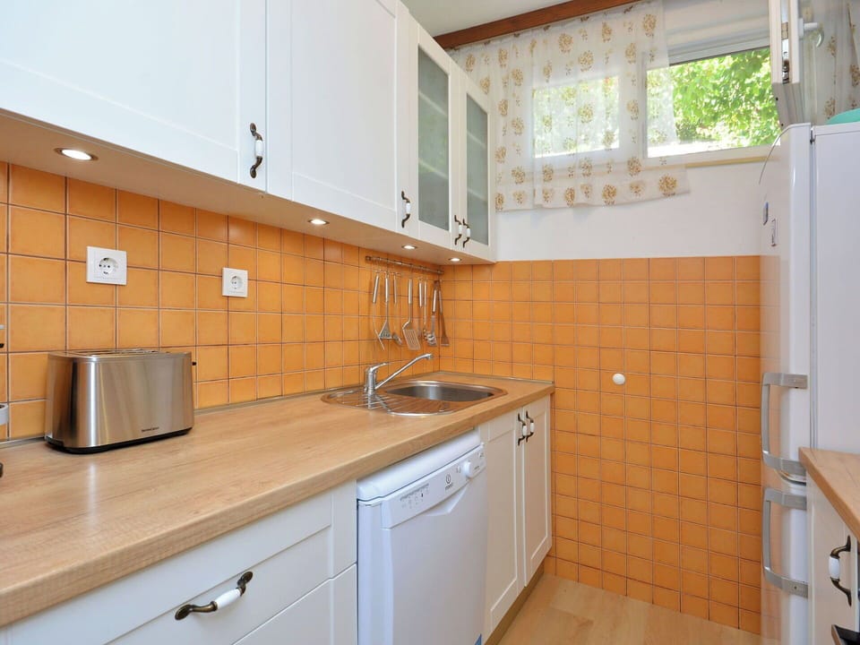 Countertop, Kitchen, Kitchen Appliance, Cabinetry, Kitchen Sink, Major Appliance, Sink, Plumbing Fixture, Flooring, Interior Design