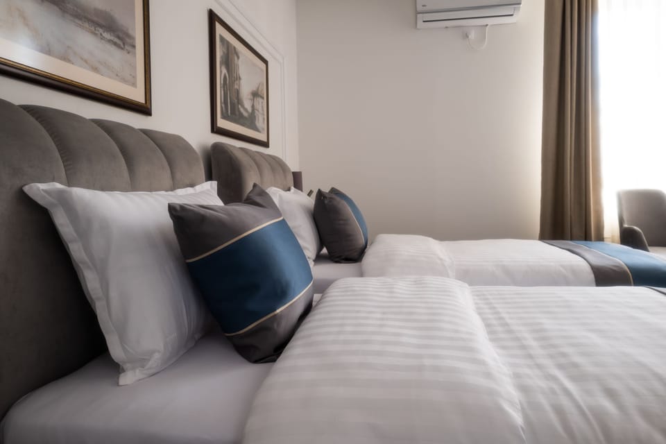 Standard Twin Room, City View | Desk, blackout drapes, soundproofing, travel crib