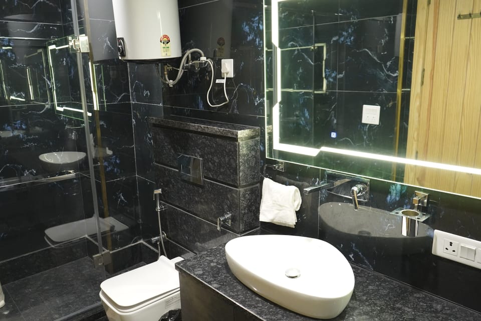 Deluxe Apartment, Mountain View | Bathroom | Shower, bathrobes, slippers, towels