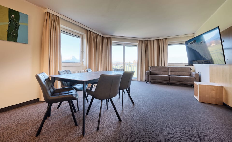 Junior Suite, Balcony, Mountain View | Living area | TV, offices
