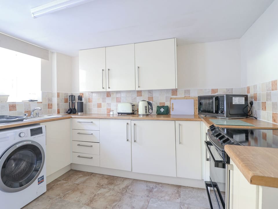 Fridge, microwave, toaster, cookware/dishes/utensils