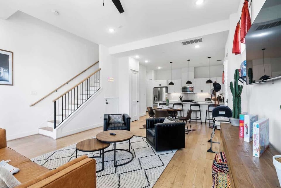 Kick back and relax in our living room, featuring a large TV perfect for movie nights or catching your favorite shows. Comfort and entertainment in one stylish space!