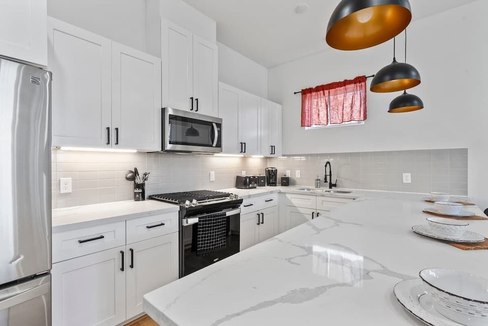 Brighten your culinary experiences with our elegant pendant lights in the kitchen, adding both style and warmth to your cooking space.