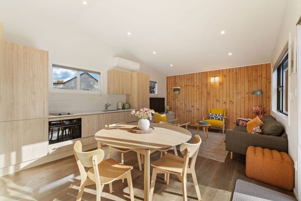 Living Room: Bright and inviting space with mountain views, perfect for relaxation and laughter!