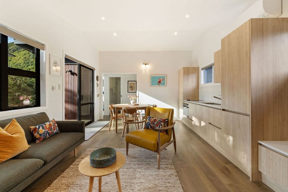 Living Room: Bright and airy space with colorful accents, perfect for relaxation or gathering!