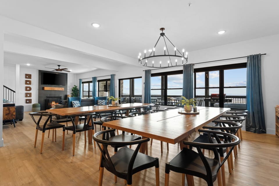 Spacious dining area with 2 large tables and seating for 24