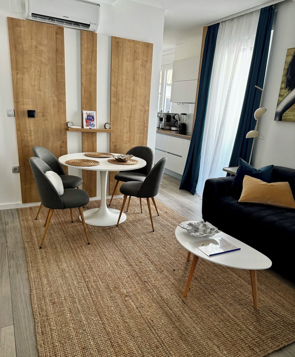 Premium Duplex | Living area | TV, video-game console, toys, books