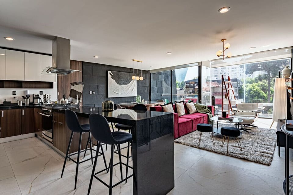 Modern kitchen and breakfast bar just steps from the cozy living area