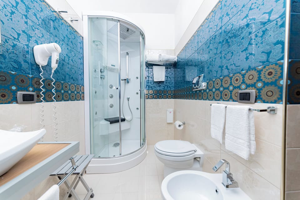 Superior Room, Balcony, Sea View | Bathroom | Shower, hair dryer, bidet, towels