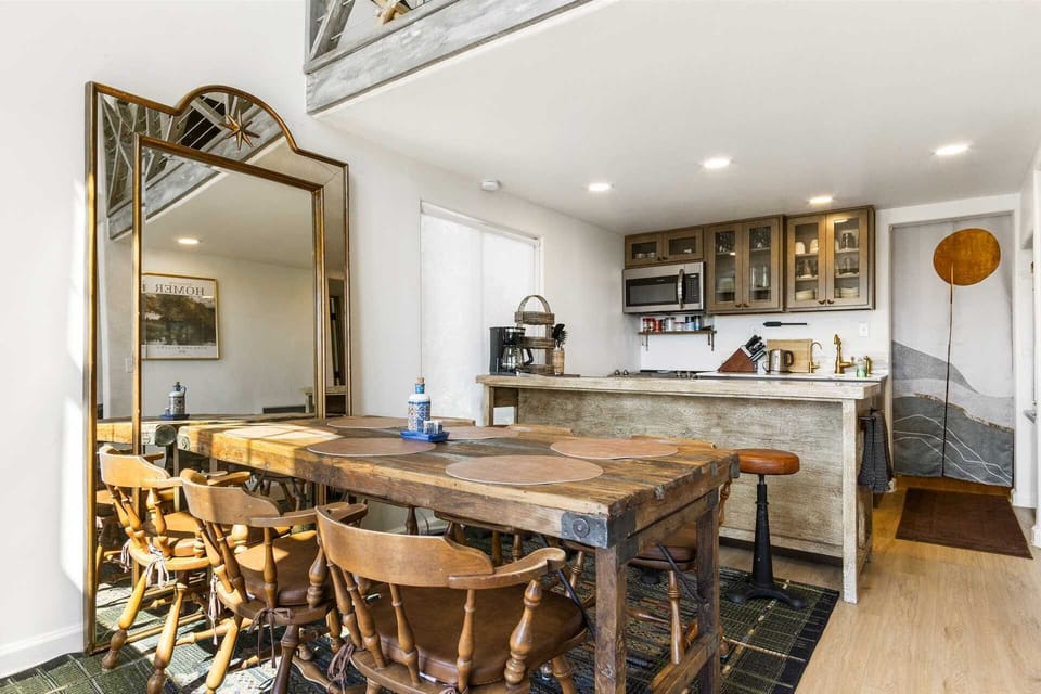 Rustic dining meets modern convenience in this cozy kitchen-perfect for shared meals and relaxed mornings.