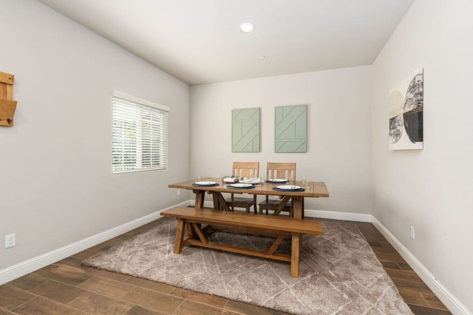 Sophisticated Dining Area! This spacious dining room comfortably seats six, making it perfect for family meals, celebratory dinners, or a cozy evening in. A beautiful setting for every occasion!