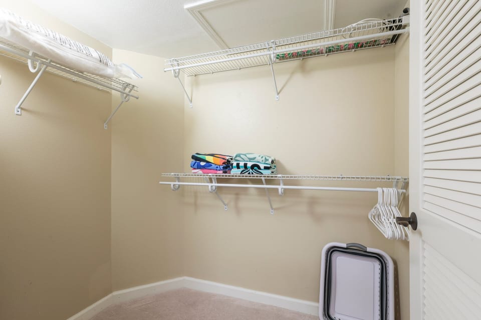 The master bedroom has a large walk-in closet