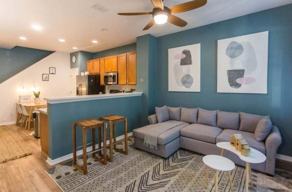 Kick back and relax in a large, comfortable living room designed for quality time. Whether it's movie night, game night, or just lounging around, there's plenty of space for everyone to gather and unwind.