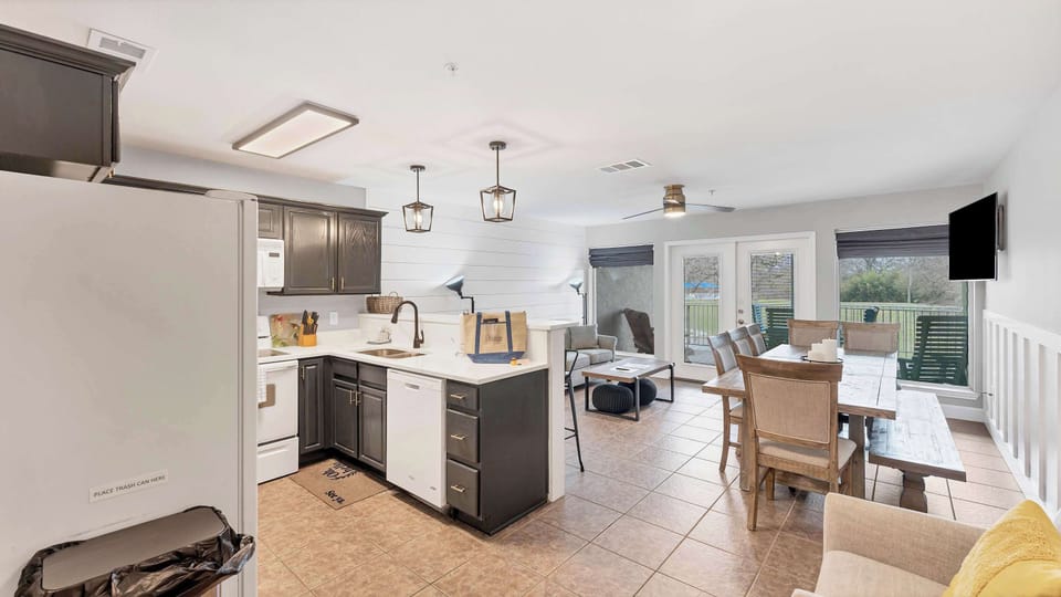 The open-concept living and kitchen area welcomes you with plenty of space to gather, dine, and relax in comfort.