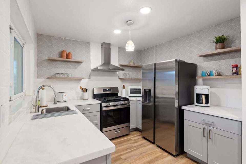 Bright and functional kitchen with sleek appliances and a cozy breakfast area