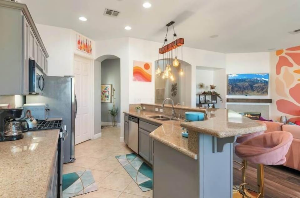 Sleek, open kitchen designed for cooking and connection.