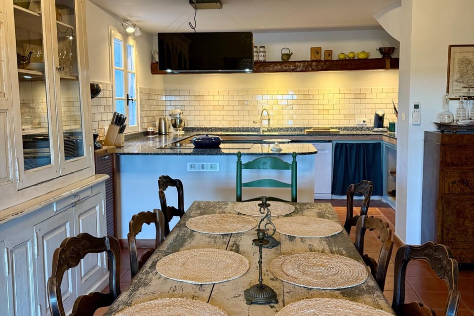 Fully equipped kitchen with large double oven and huge induction hob.  Island cooking over looking the mountains.