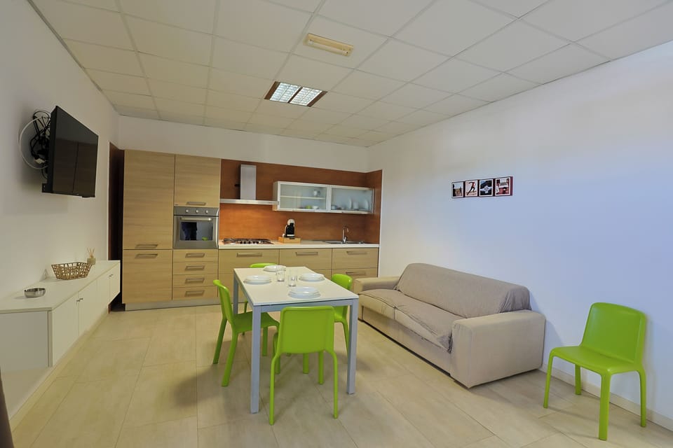 Deluxe Suite, Kitchen, Garden View | Desk, laptop workspace, soundproofing, free WiFi