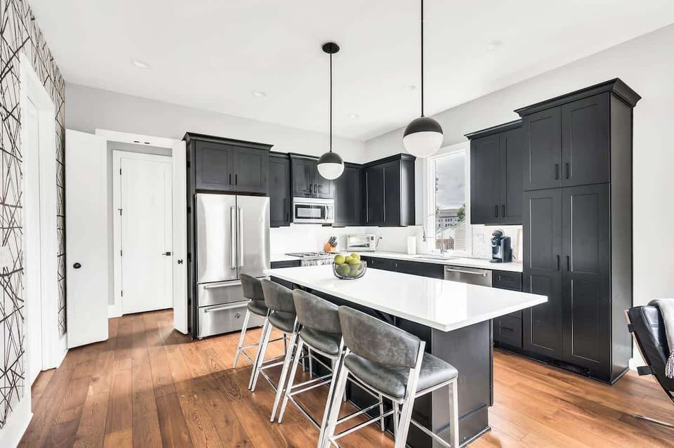 Enjoy your meals in this chic dining area, where contemporary design meets functionality. Whether you're preparing a home-cooked meal or ordering takeout, this space is perfect for dining in style.

