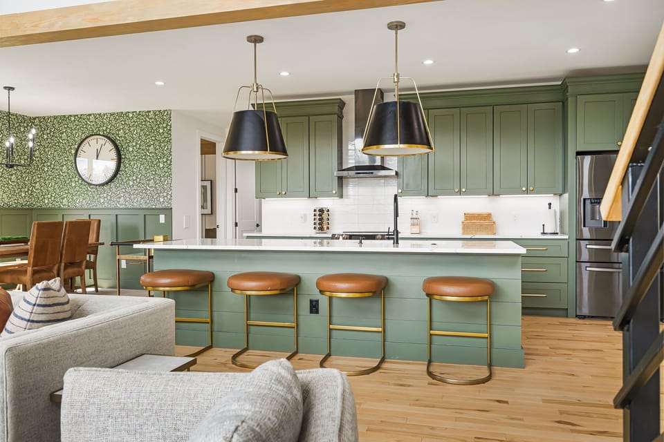 Gather the group around the open kitchen-and-dining setup where the meals and the memories happen at once. Pull up a stool and stay a while.