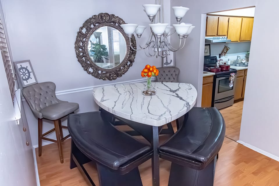 Dining area near full kitchen.