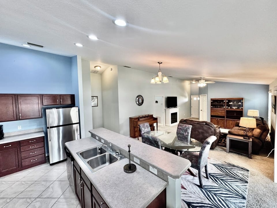 Kitchen with Island, Cooking Necessities, Stainless Steel Appliances and Large Pantry.