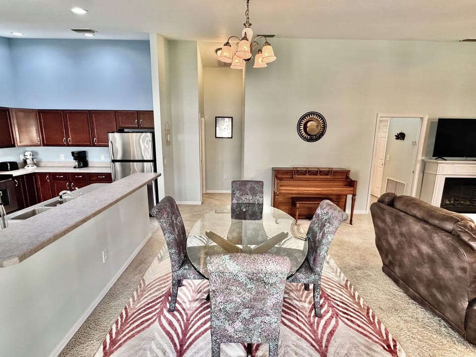 Formal Dining with Guest Quarters to the Right of the Piano
