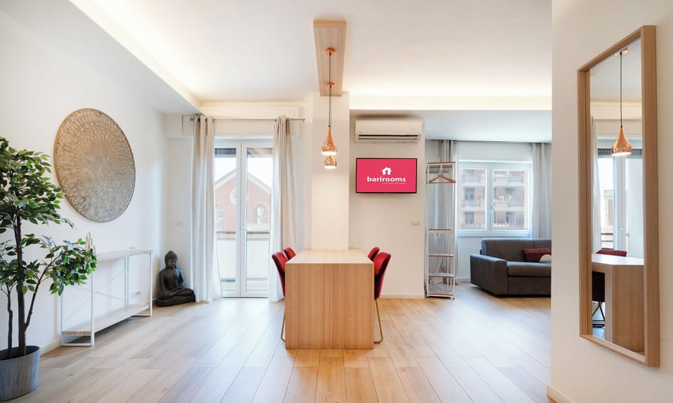 Quadruple Room | Living area | TV