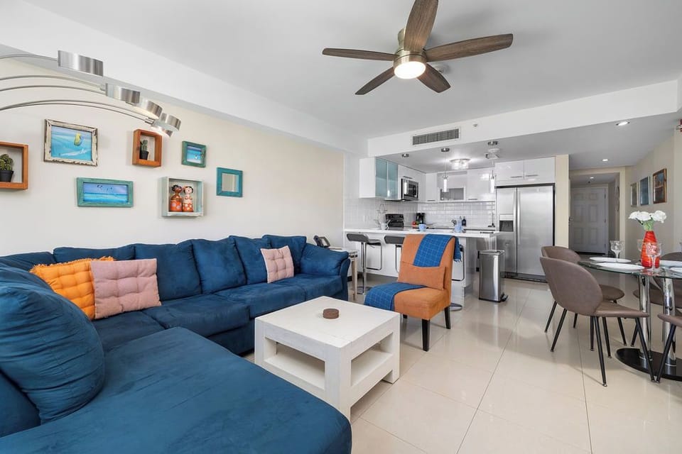 Spacious living area with a modern kitchen, perfect for entertaining.