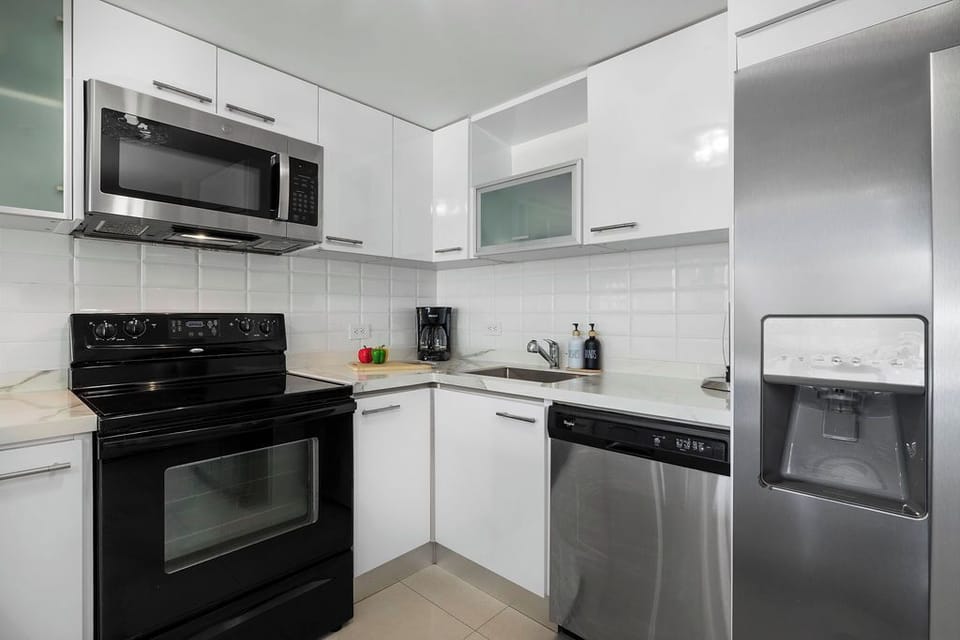 Create island-inspired meals in a fully equipped modern kitchen with stainless appliances, then dine in comfort at the indoor table or breakfast bar.