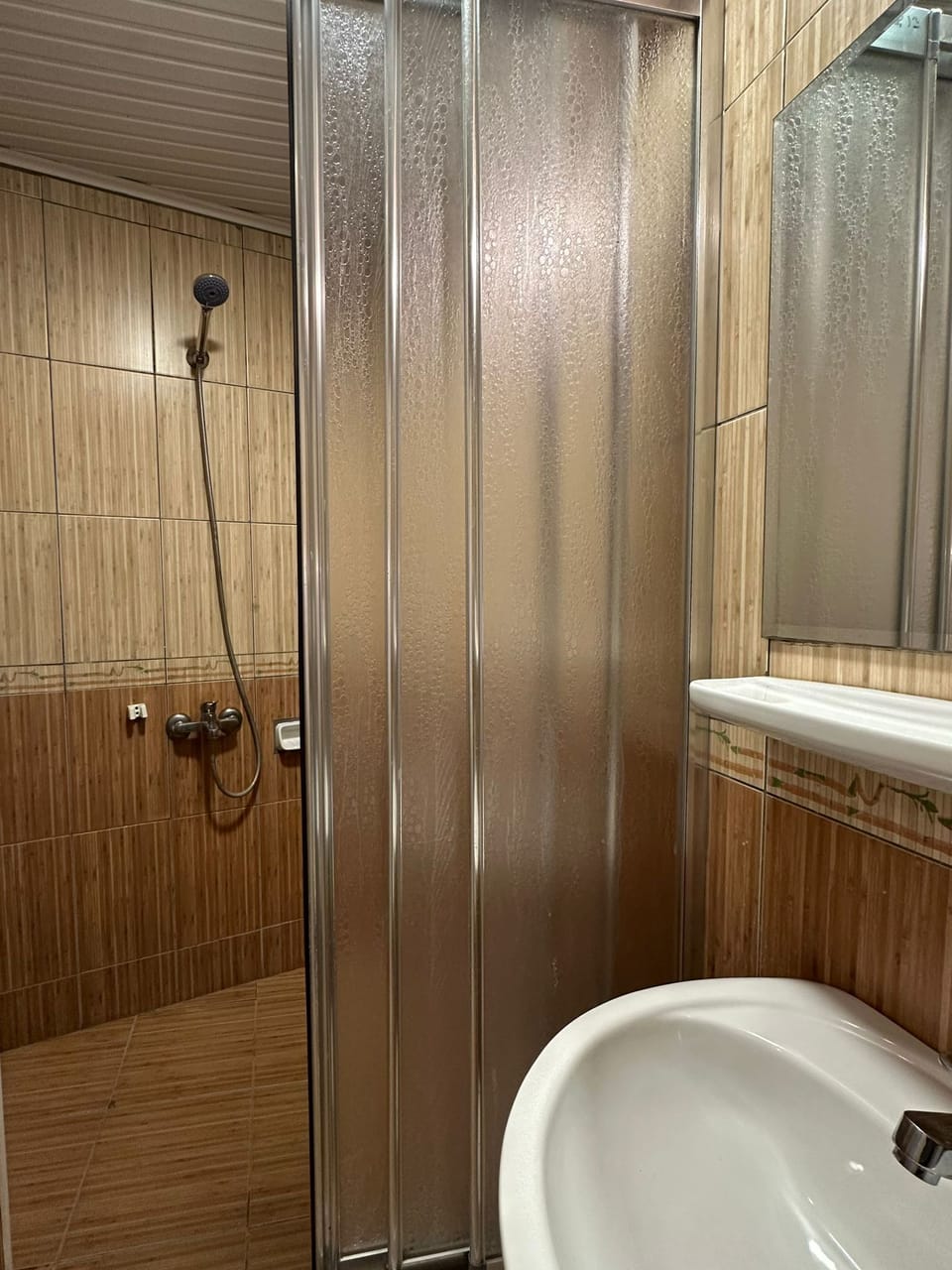 Shower, designer toiletries, hair dryer, towels